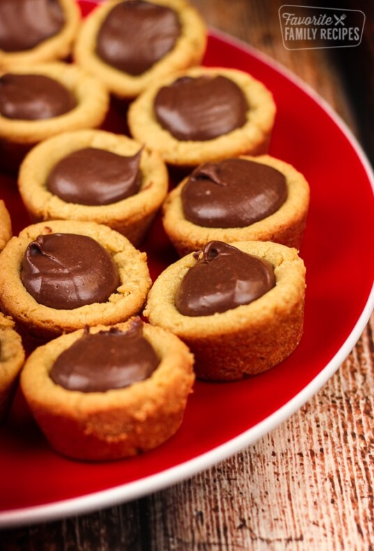 Peanut Butter Fudge Puddle cookies on a red plate.