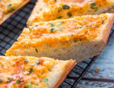 Hot Cheese Bread Slices on a cooling rack.