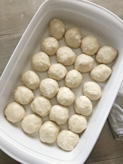 dinner roll dough in a baking dish