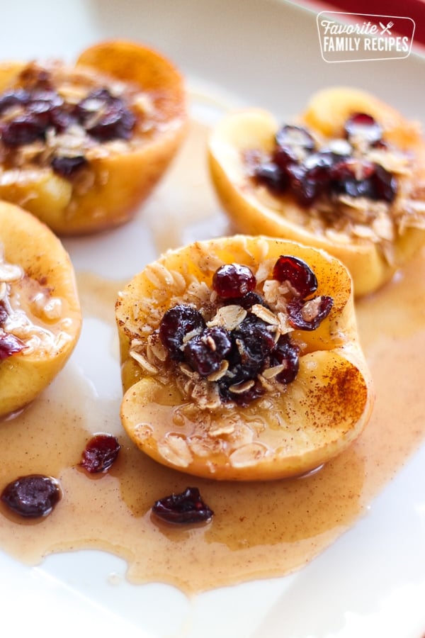 4 Microwave Baked Apples on a white plate.