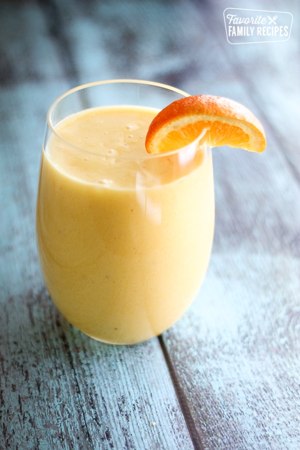 Orange Pineapple Banana Smoothie in a glass.