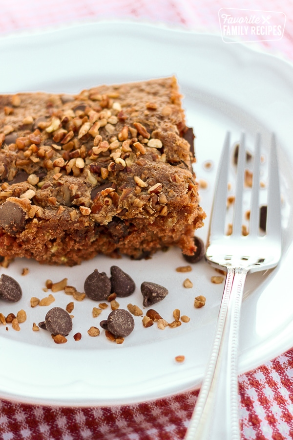 A slice of Picnic Cake on white plate.