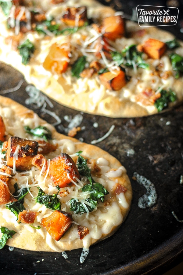 Butternut squash pizza on a grill. 