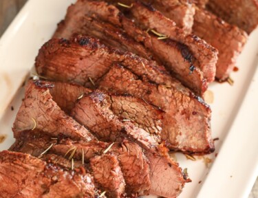 Thin Sliced Rosemary Tri Tip on a Serving Plate