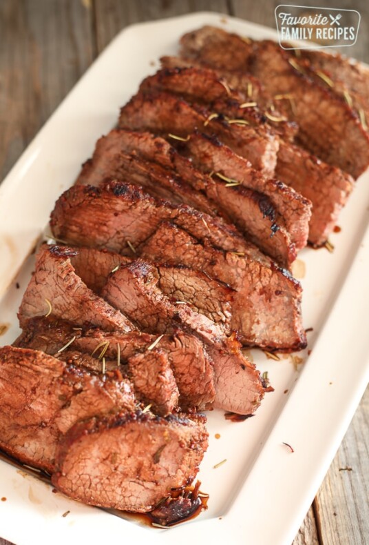 Thin Sliced Rosemary Tri Tip on a Serving Plate