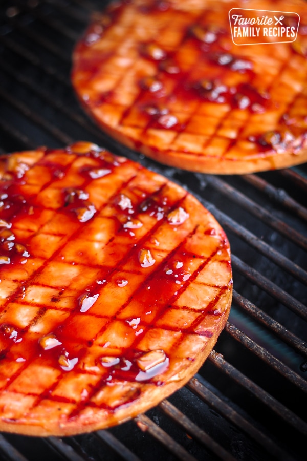 Grilled ham steaks on a grill. 