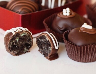 A red heart box filled with Oreo truffles