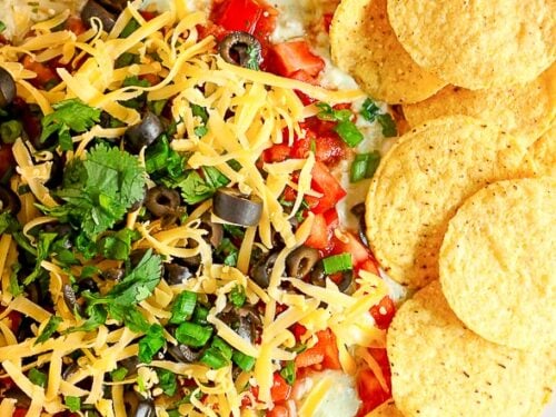 9 Layer Bean Dip Surrounded By Tortilla Chips