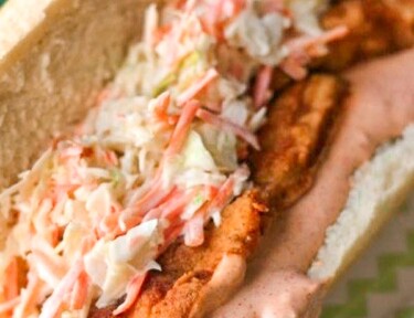 Cajun Fried Chicken Po Boys with Spicy Remoulade Sauce on a bun.