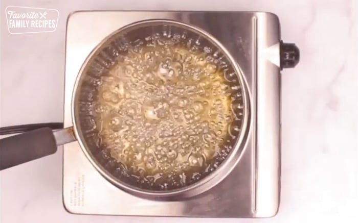 Candy apple sauce in a saucepan.