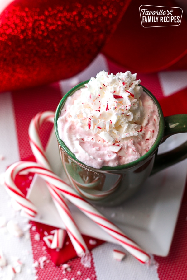 Candy Cane Hot Chocolate in a Mug with candy canes on the side