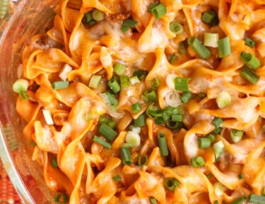 Above view of Cheesy Enchilada Casserole in a glass pan.