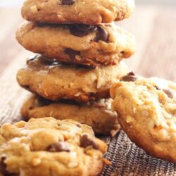 Coconut Butterscotch Chocolate Chip Cookies stacked on top of each other.