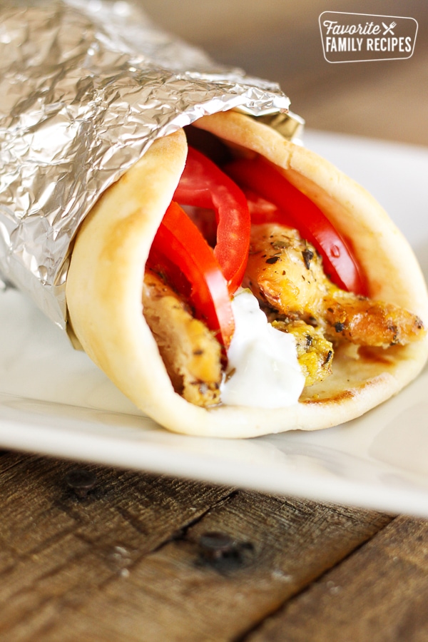 Easy Crock Pot Chicken Gyros on white plate. 