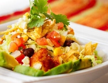 Fiesta Fish Taco Bowl topped with cilantro in a white bowl.