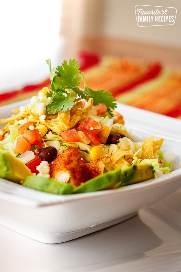 Fiesta Fish Taco Bowl topped with cilantro in a white bowl.