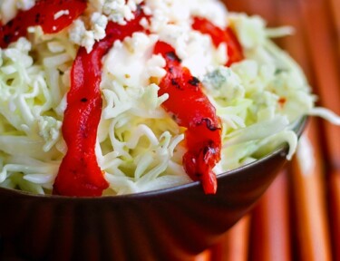 Red Pepper Coleslaw in a black bowl.