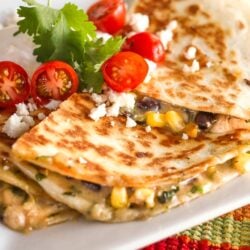 Low-Cal Veggie Quesadillas topped with tomatoes, cilantro, and feta cheese.