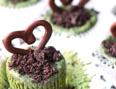 Mini Grasshopper Cheesecakes topped with chocolate hearts.