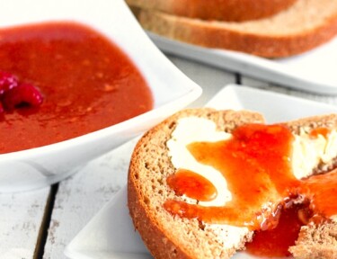 Raspberry peach freezer jam on a slice of toast.