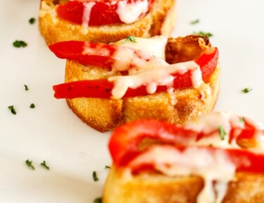 Red pepper bruschetta on a white tray