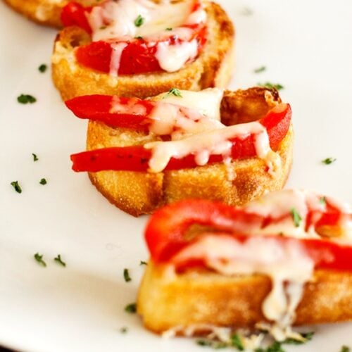 Red pepper bruschetta on a white tray