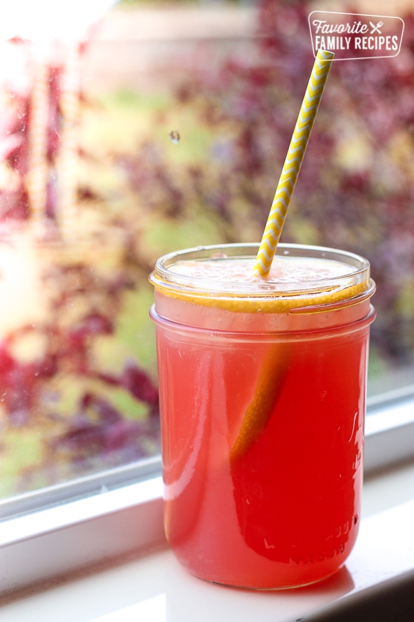 Sparkling Citrus Punch in a jar with a straw. 