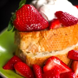 Strawberry and Cream Cheese French Toast on a plate with fresh strawberries
