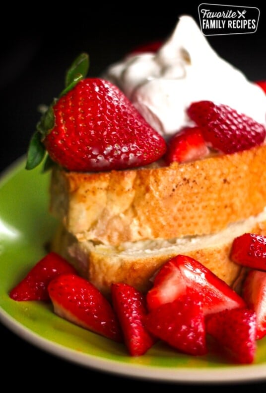 Strawberry and Cream Cheese French Toast on a plate with fresh strawberries