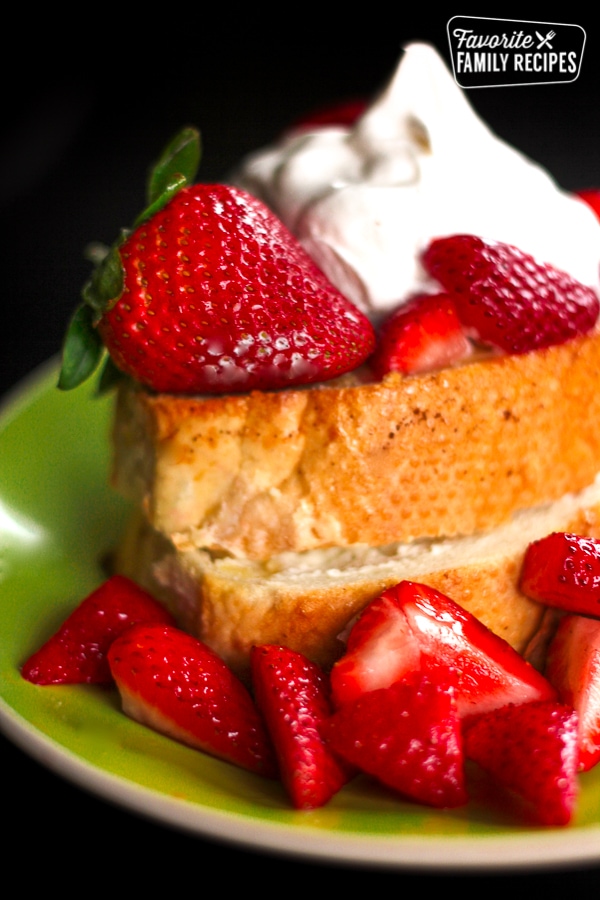 Strawberry and Cream Cheese French Toast on a plate with fresh strawberries