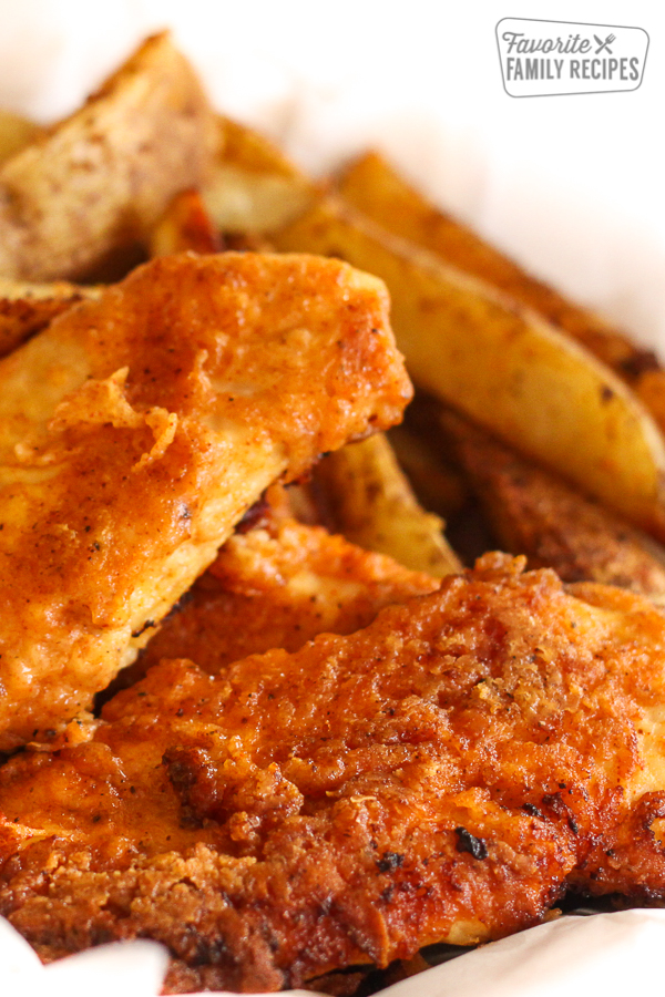 Oven Fried Chicken with steak fries on the side.