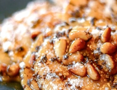 Butternut Squash Ravioli with chocolate shavings on a plate.