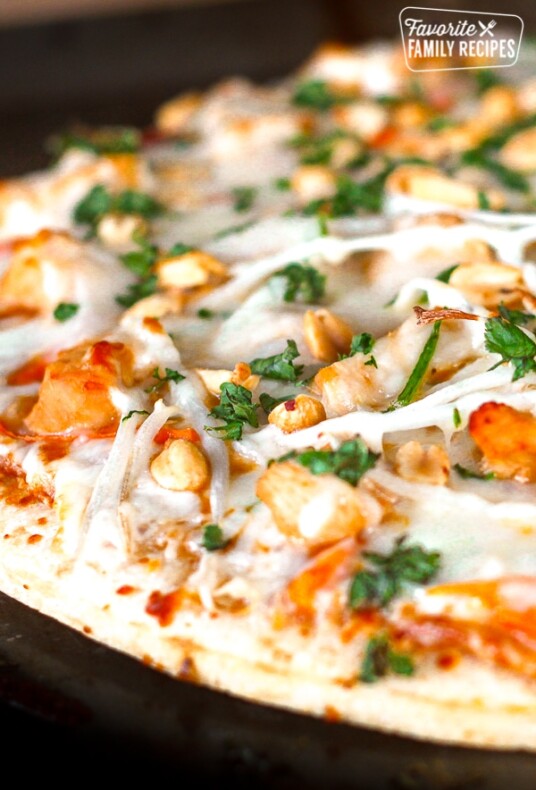 California Pizza Kitchen Thai Chicken Pizza topped with peanuts and cilantro.