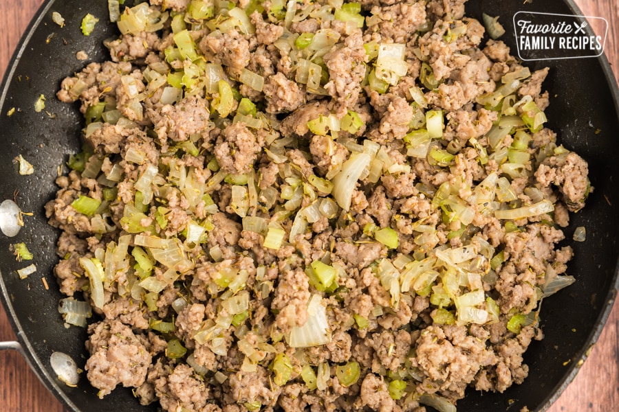 Sausage, onion, celery, and spices in a skillet