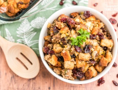 Cranberry sausage stuffing in a white bowl