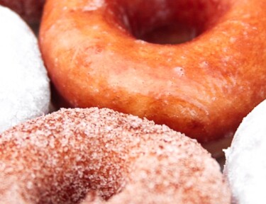Close up of glazed, sugar, and powdered sugar Homemade Doughnuts