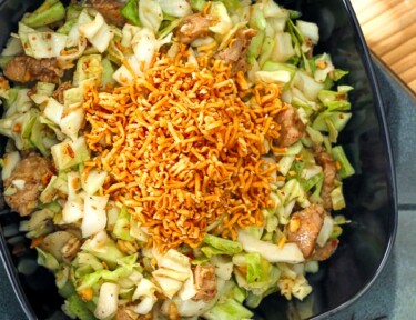 Pai Mai salad in a black bowl.
