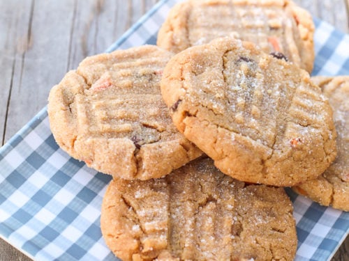 plate of 5 peanut butter cookies on plaid plate