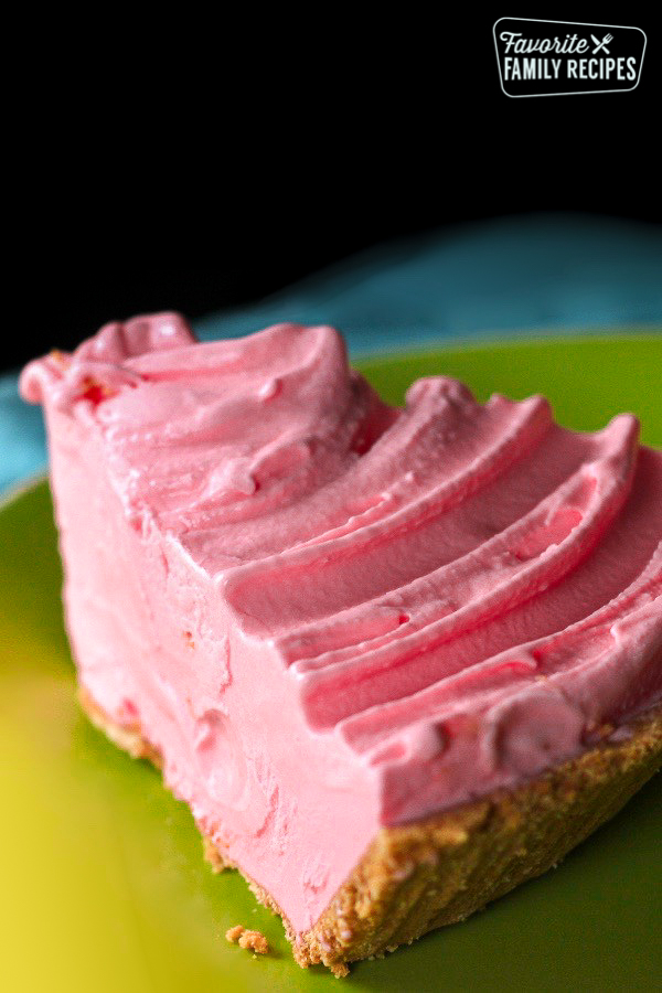 Slice of Pink Lemonade Ice Cream Pie on a plate