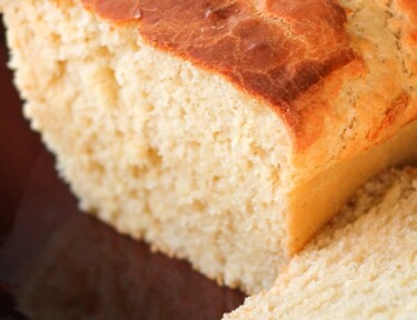 Sally Lunn bread with a slice cut off the end.