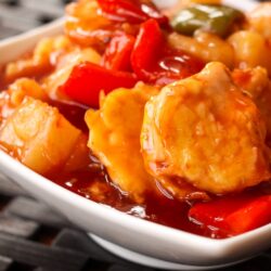 Baked Sweet and Sour Chicken in a white bowl.