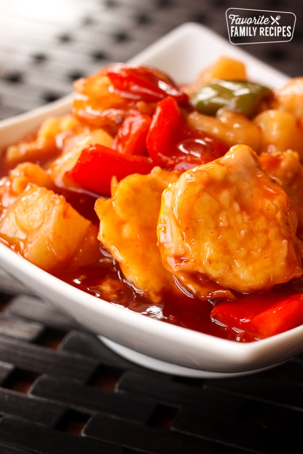 Baked Sweet and Sour Chicken in a white bowl.