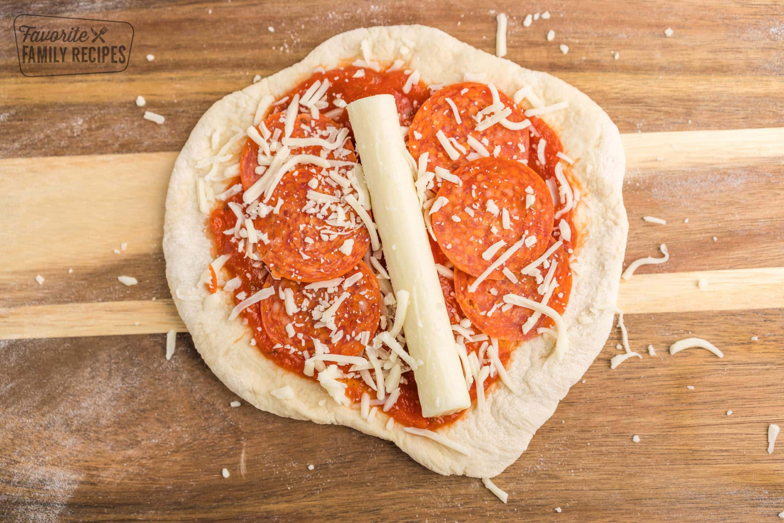 Pizza toppings inside a circle of pizza dough