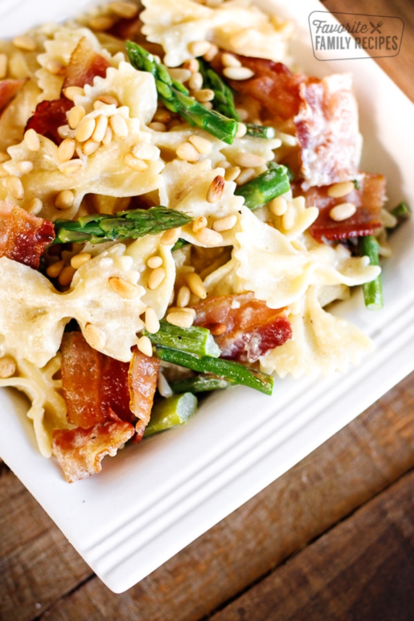 Creamy Bowtie and Asparagus Pasta on a white dish.