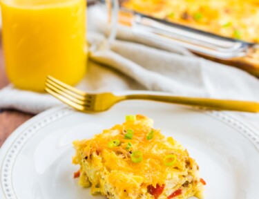 Breakfast Egg Casserole on a plate made with eggs, cheese, sausage, and peppers