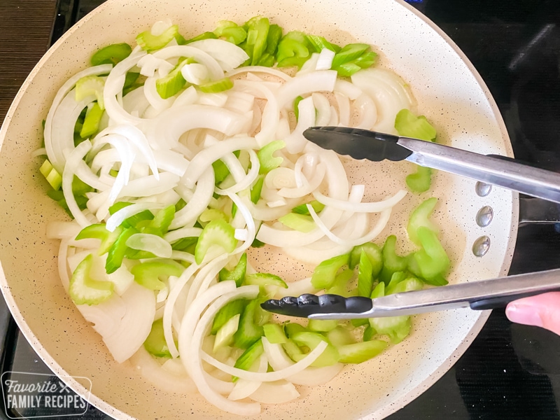 Onions and celery being sautéed