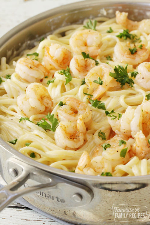 Shrimp Alfredo in a large skillet.