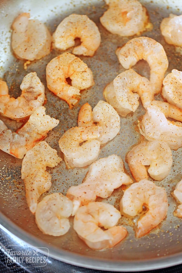 Shrimp cooking in a frying pan.