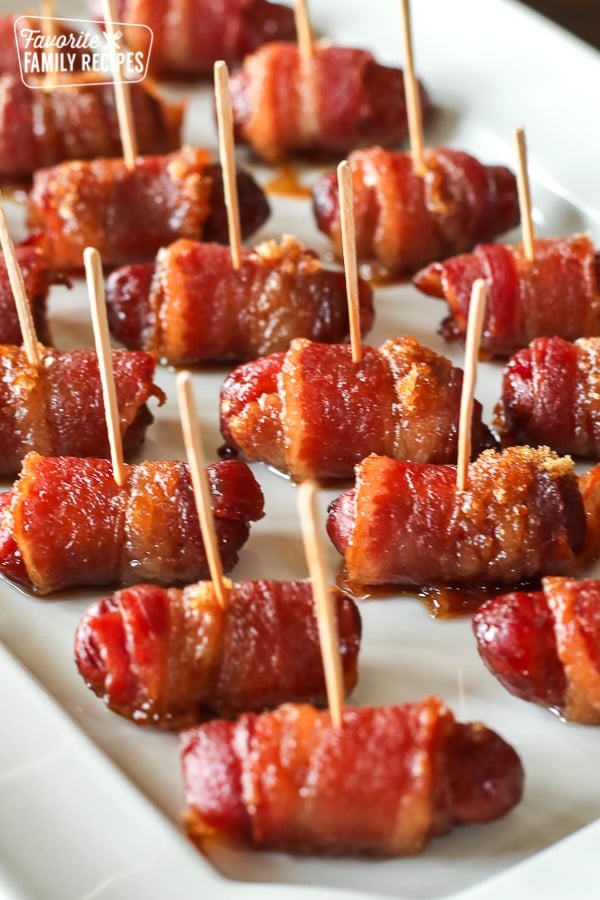 Bacon Wrapped Little Smokies Appetizers served on a white tray close-up view.