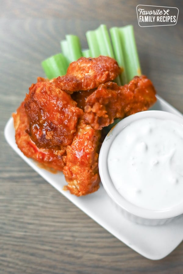 Boneless Buffalo Wings with Celery and Blue Cheese Dip.